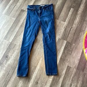 Levi’s slimming skinny jeans dark wash.